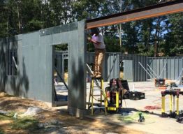 After all panels installed, beam wrapped at garage