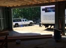 Completed trusses bearing on garage beam